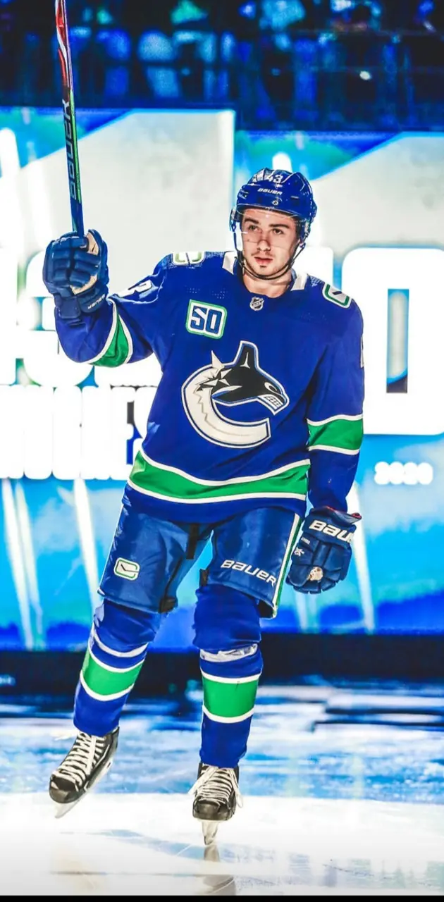 Download Quinn Hughes in Retro Black Jersey during Game Opening Wallpaper
