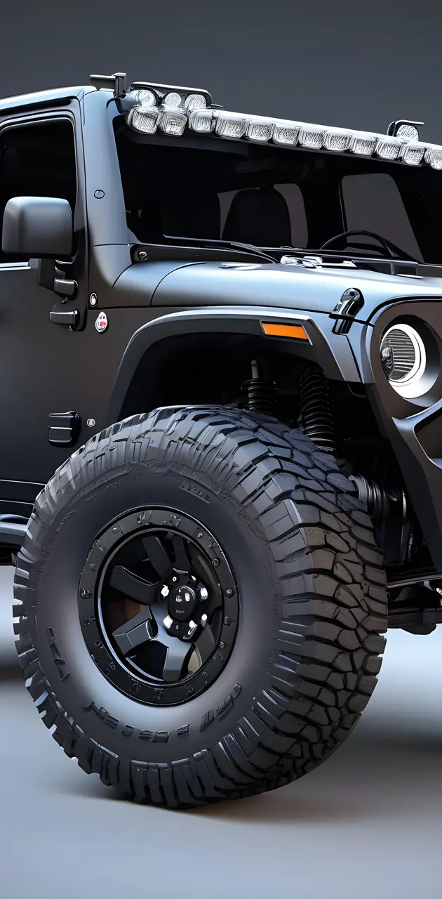 a black jeep with large tires
