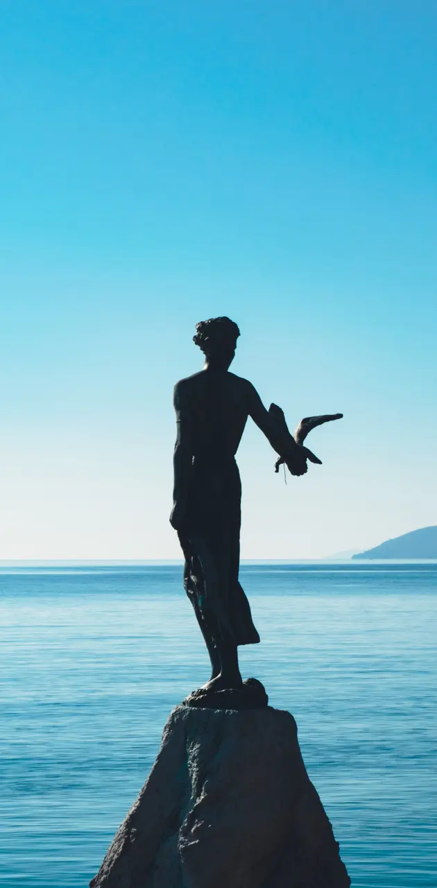 Woman statue at sea