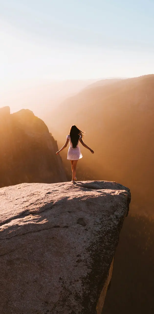 Girl on edge of cliff
