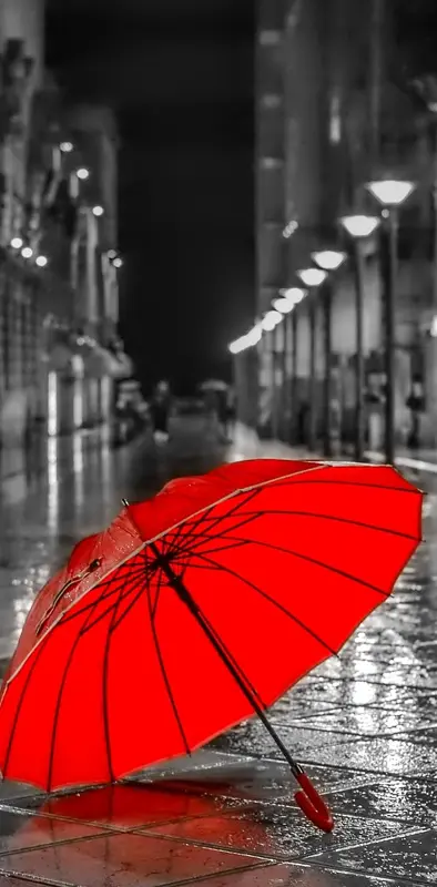 red umbrella in city