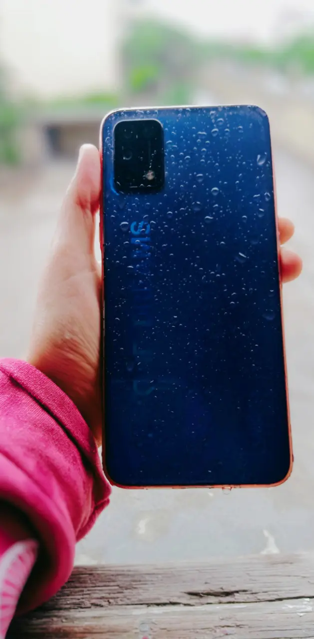 Blue phone in the rain