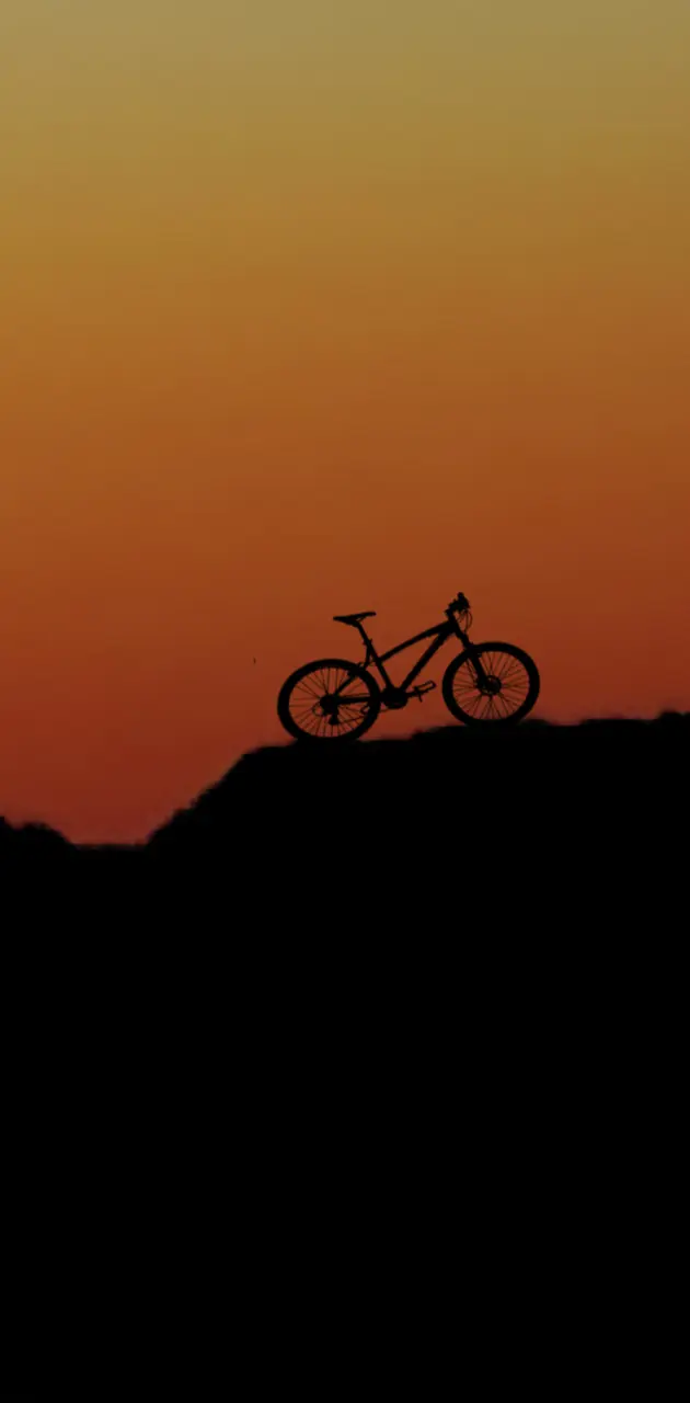 Bike sunset mountain
