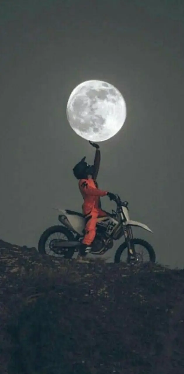 Biker touches Moon