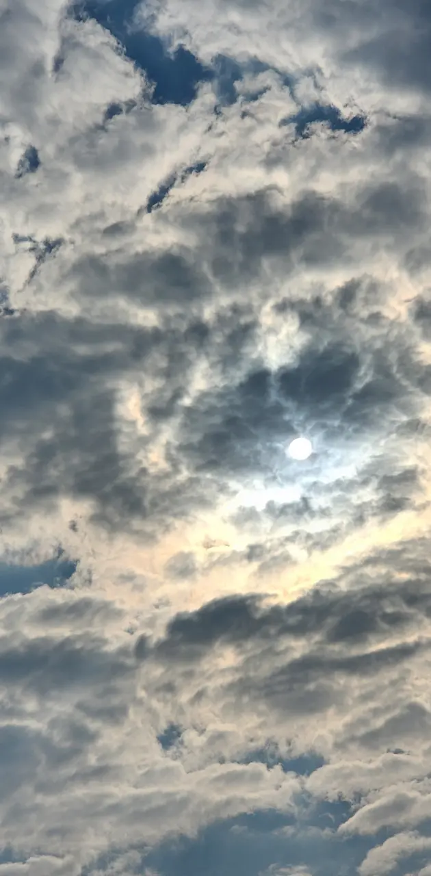 Sun behind cloud