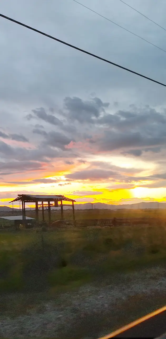 Cloudy sunset field 